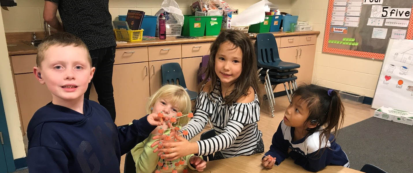 teacher using asl with a class of students