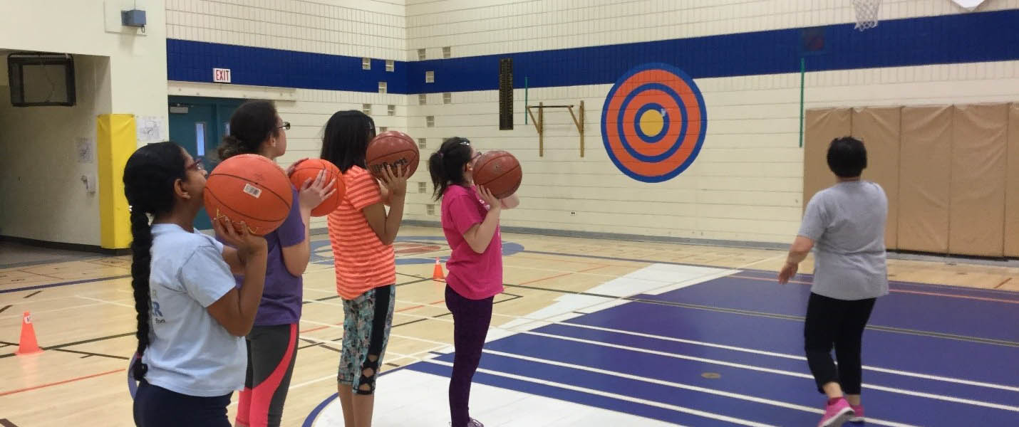 students playing basketball