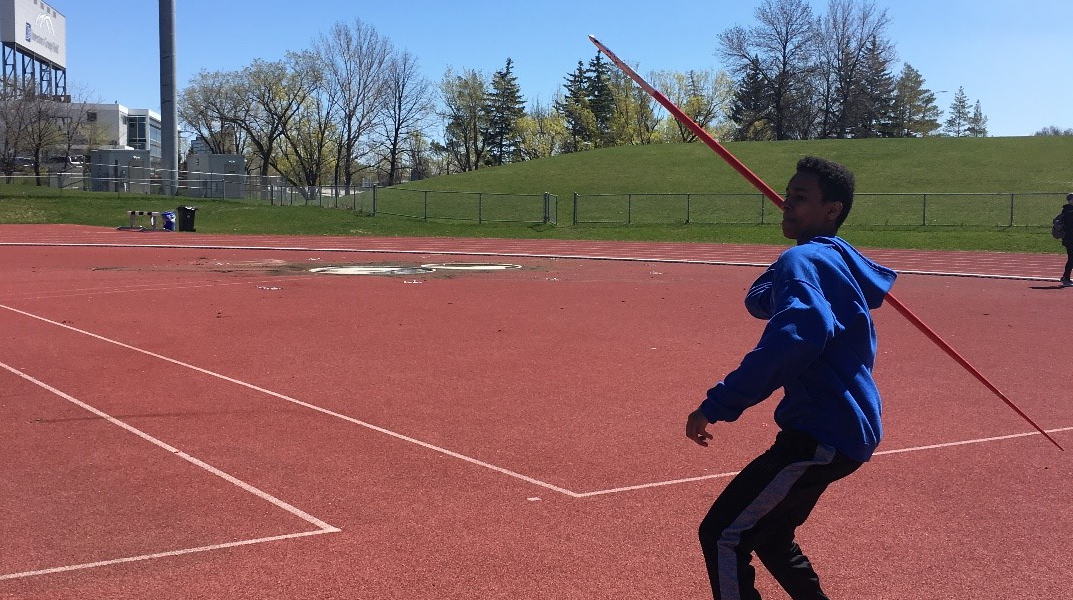 An MSD student throwing a Javelin