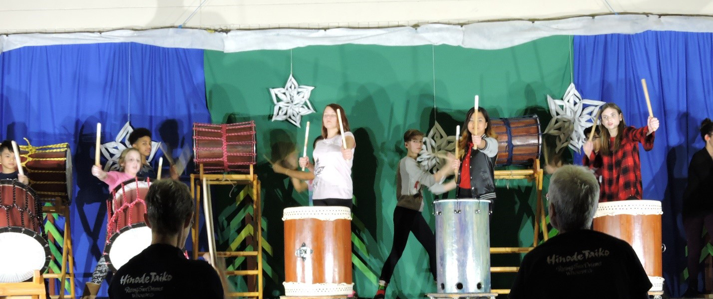 Students performing on drums