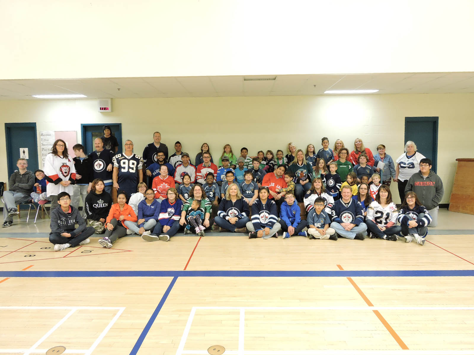 staff and students in their favorite sports team's jerseys - bombers, jets, team canada, blue jays, moose